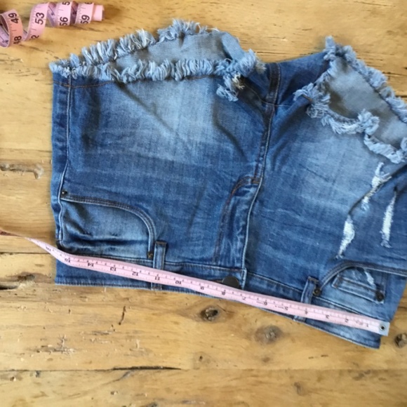 29” STS Blue jean shorts feature a distressed design with a dark blue wash - Picture 6 of 8